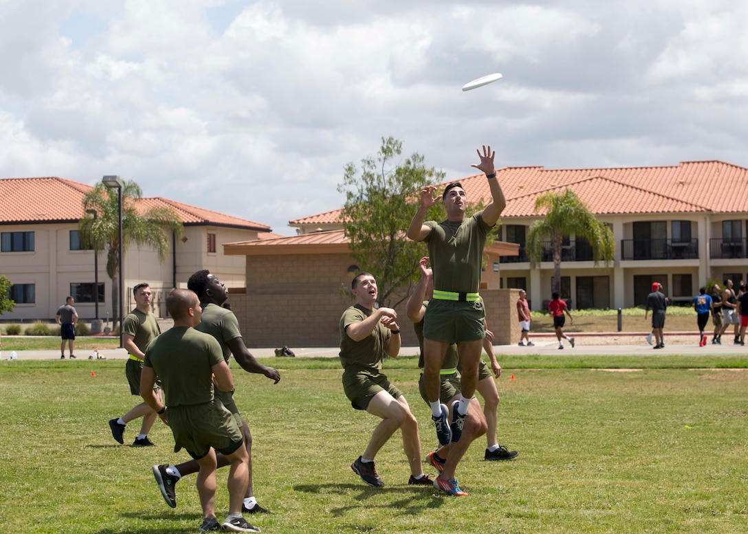 Marines with Headquarters and Headquarters Squadron participate in an ultimate Frisbee game on MCAS Miramar, Calif., May 17. The game was held to bring non-commissioned officers together to build unit cohesion. (U.S. Marine Corps photo by Cpl. Nadia J. Stark/released)