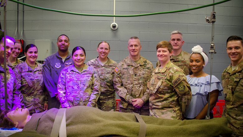 Army Command Sergeant Major John Wayne Troxell visits with the Aeromedical Evacuation Squadron during his visit to Pope - one of several stops on base.