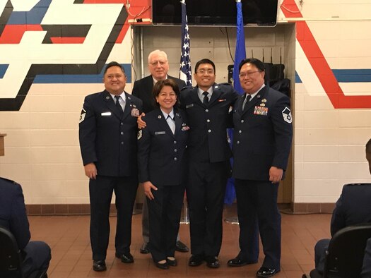 2nd Lt. Francis Ambion, 4th Space Launch Squadron Mission Integration Flight electrical engineer, poses for a photo with his family members who are all military veterans