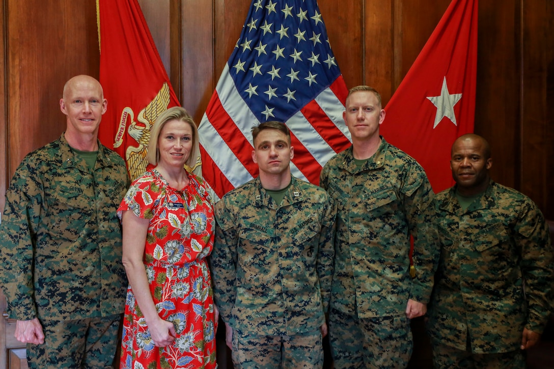Brig. Gen. James F. Glynn, the Commanding General of Marine Corps Recruit Depot Parris Island, and Sgt. Maj. William Carter, the depot Sergeant Major, pose for a photo with Parris Island Navy-Marine Corps Relief Society representatives on MCRD Parris Island, S.C., March 20, 2019. The NMCRS’s mission is to provide financial aid, education and other assistance to members of the Naval Service of the United States, family members, and survivors in need. (U.S. Marine Corps photo by Lance Cpl. Daniel Johnson/Released)