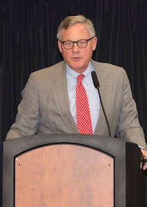 Sen Burr at the podium speaks to NSA employees and guests at 2019 Law Day.