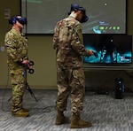 Master Sgt. Ryan Stark (left), 344th Training Squadron special programs manager from Joint Base San Antonio-Lackland, leads U.S. Air Force Staff Sgt. Krystopher Fletcher, 19th Maintenance Group aerospace propulsion instructor, through a virtual reality scenario of the inside of an aircraft May 2, 2019, at Little Rock Air Force Base, Arkansas. Stark and other 344th members TRS visited Little Rock Air Force Base to showcase Integrated Technology Platform, a campaign to use virtual reality to train students using software called Virtual Hangar.