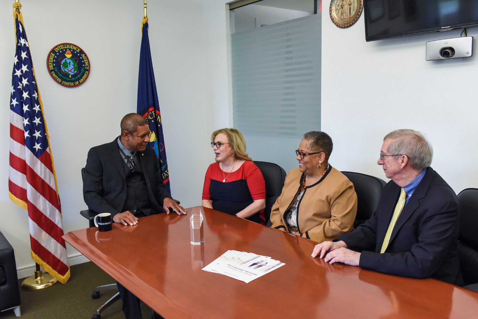 From the left, Defense Intelligence Agency Chief of Staff Johnny Sawyer, and DIA officers Theodora Fitzsimmons, Cynthia Covington and Rick Herrick discuss DIA's Coaching Program.