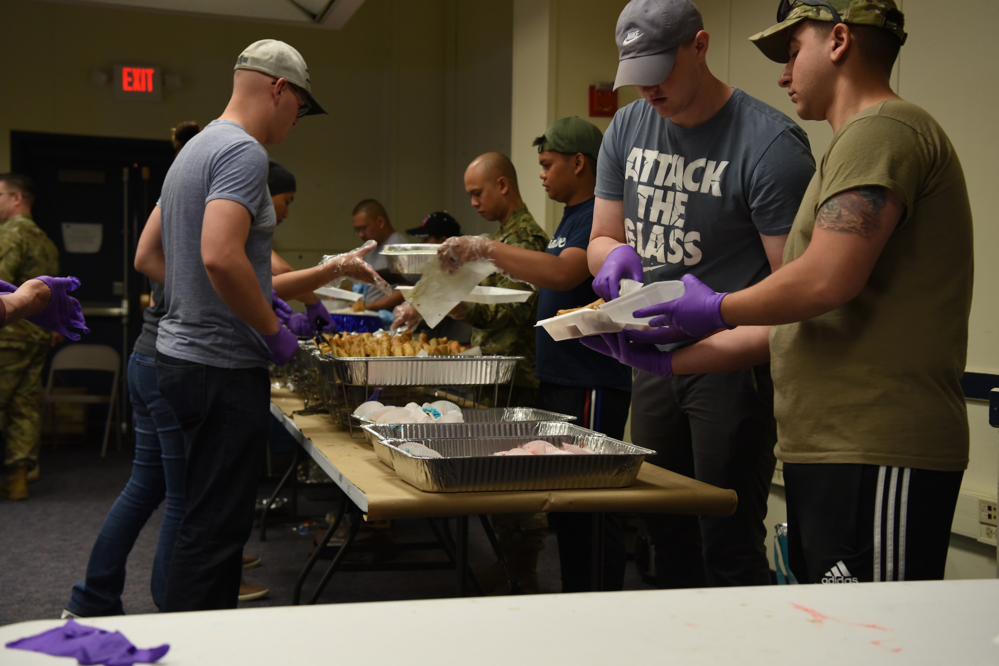 Volunteers serve food at the Asian-American Pacific Islander Heritage Cultural Show and Luncheon at Kirtland Air Force Base, N.M., May 22, 2019. Attendees were treated to a meal as well as cultural performances. (U.S. Air Force photo by Senior Airman Eli Chevalier)