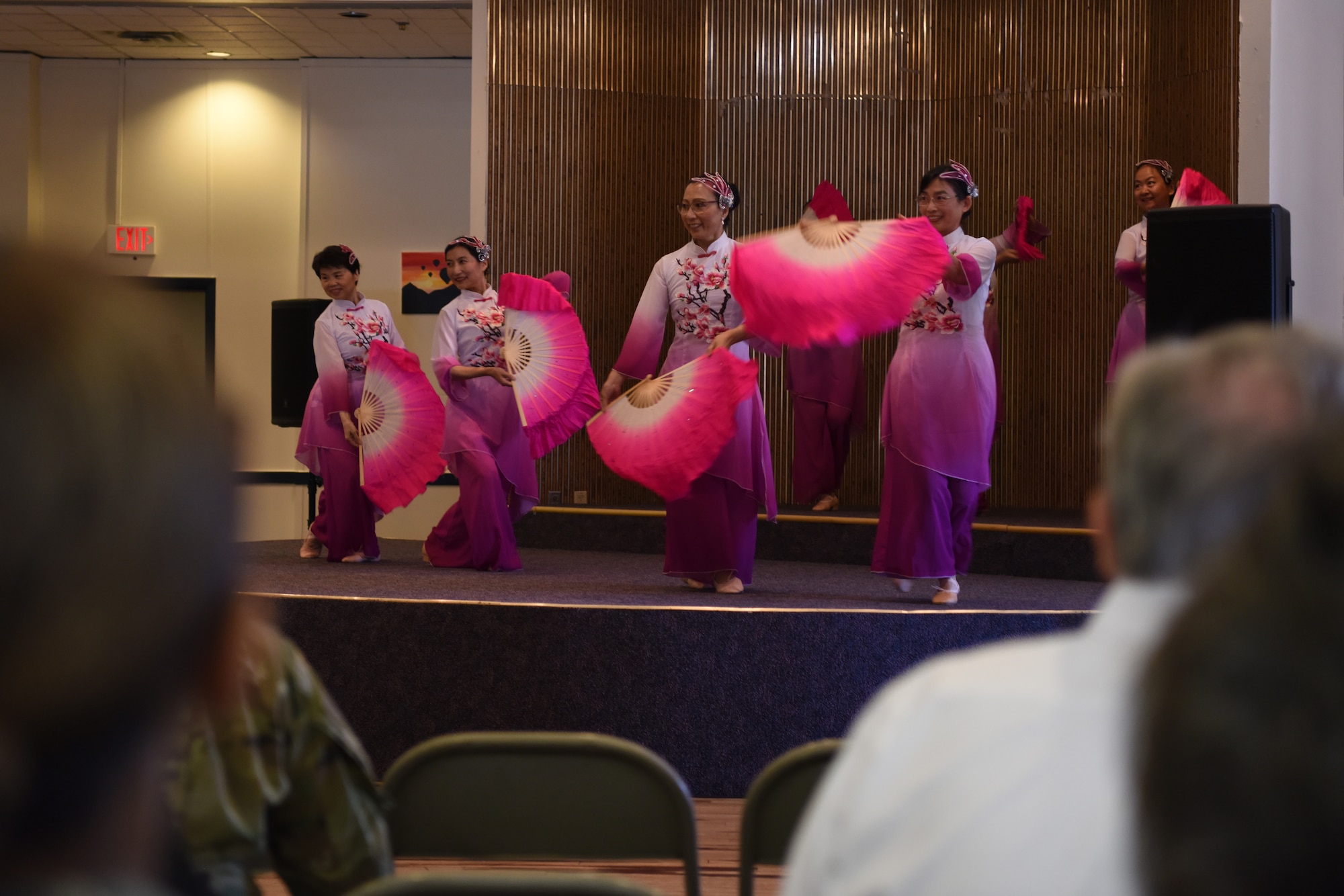 Audience members of the Asian-American Pacific Islander Heritage Month Cultural Show and Luncheon watch a cultural performance at Kirtland Air Force Base, N.M., May 22, 2019. Attendees were treated to a meal as well as various performances. (U.S. Air Force photo by Senior Airman Eli Chevalier)