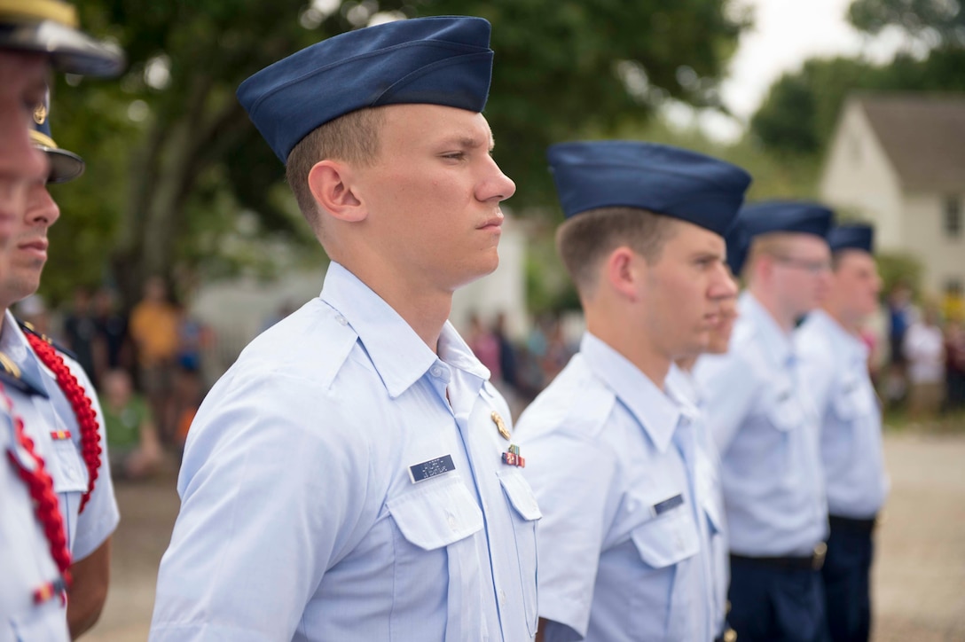 EW LONDON, Conn. - U.S. Coast Guard Academy swabs from the Class of 2022 participate in the 2018 Mystic Flag Ceremony at the Mystic Seaport, July 28, 2018.