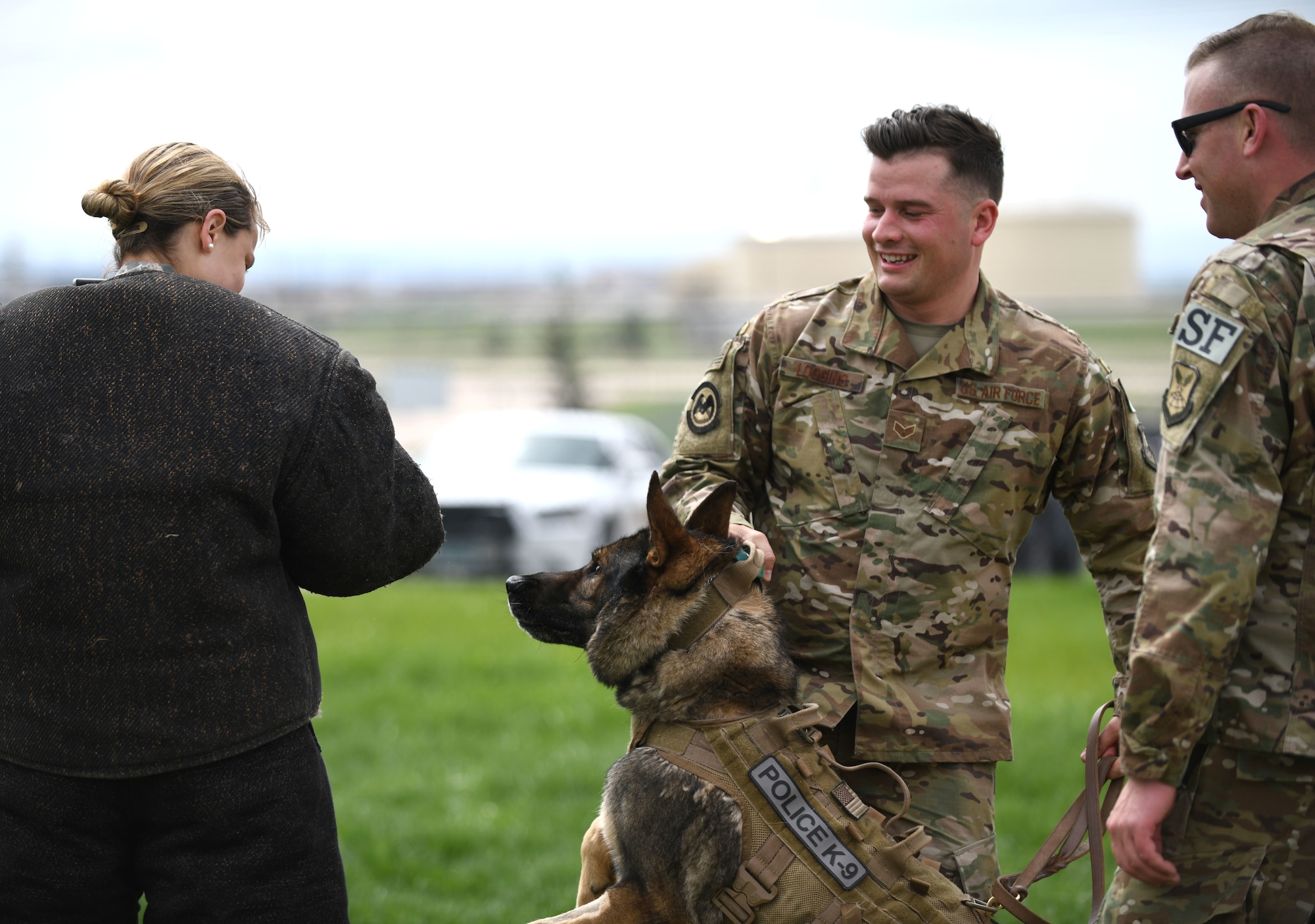 Senior Airman Chase Loggins, a 28th Security Forces Squadron military working dog handler, restrains MWD Boris during a demonstration for National Police Week on Ellsworth Air Force Base, S.D., May 16, 2019. The 28th SFS MWD competition was part of a series of events held in honor of law enforcement officers who died in the line of duty. (U.S. Air Force photo by Airman 1st Class Christina Bennett)