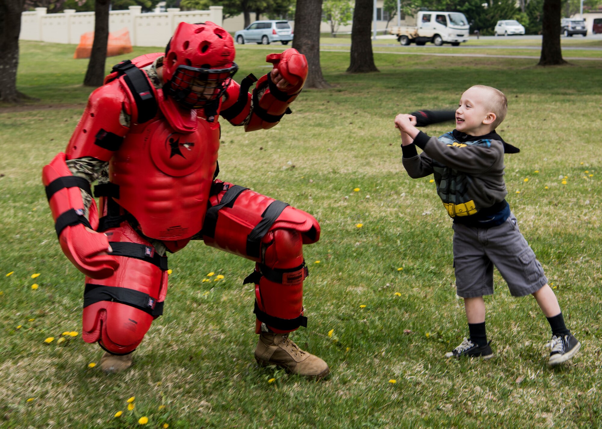 An attendee hits U.S. Navy Seaman Rodolfo Romero, a Naval Air Facility Far East Public Works Department construction mechanic and dressed as the "red man," during Police Week 2019 at Misawa Air Base, Japan, May 15, 2019. The red man training teaches how to use a baton in combat scenarios. The red man course also covers security forces concepts, operations, weapons safety, use of lethal or non-lethal force, communication procedures and vehicle searches. (U.S. Air Force photo by Airman 1st Class Xiomara M. Martinez)