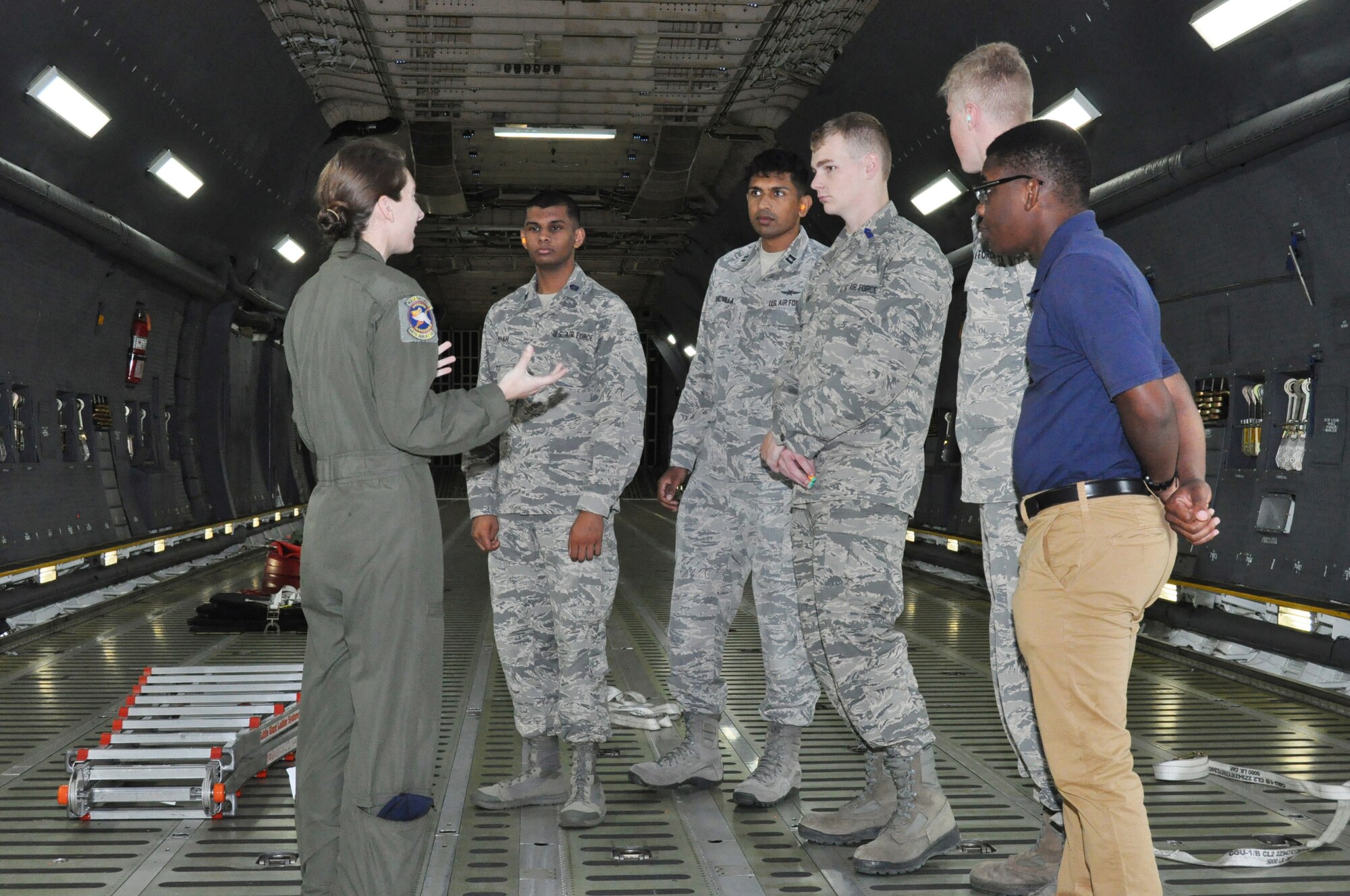 Staff Sgt. Kryssianna M. Paolo, 68th Airlift Squadron loadmaster, briefs University of North Texas Air Force ROTC cadets about her job duties on the C-5M Super Galaxy, May 16, 2019, at Joint Base San Antonio-Lackland, Texas.