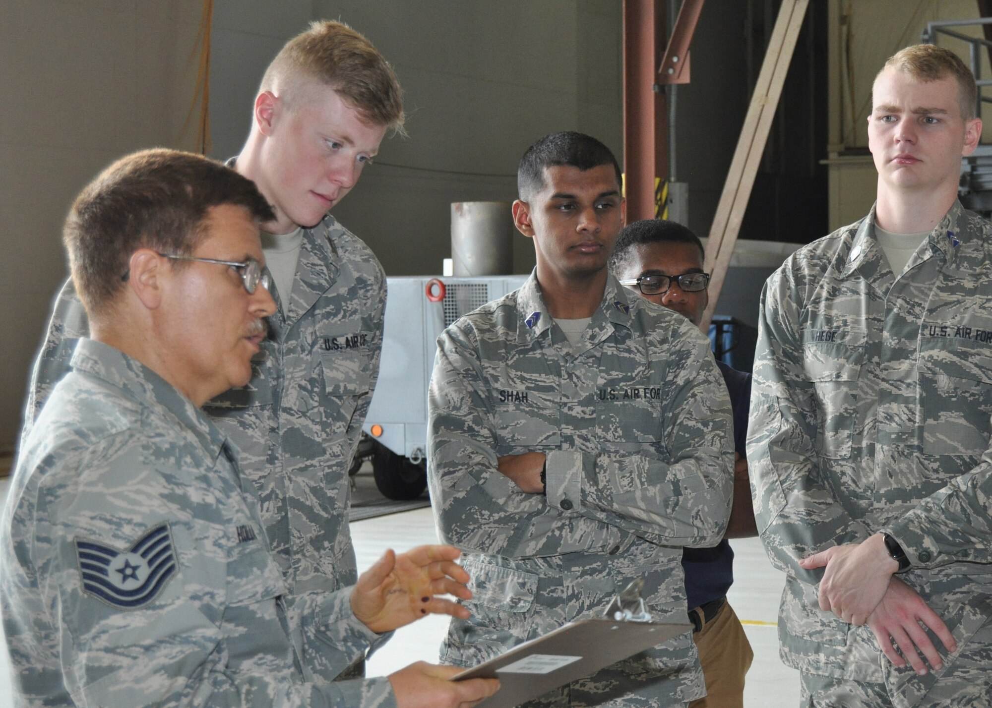 Tech. Sgt. William M. Holland 433rd Maintenance Squadron propulsion mechanic, briefs University of North Texas Air Force ROTC cadets about the C-5M Super Galaxy’s new engine, May 16, 2019, at Joint Base San Antonio-Lackland, Texas.
