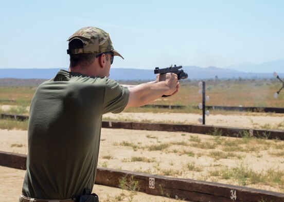 Airman 1st Class Nicholas Gurley, 412th Security Forces Squadron, participates in a shooting competition during Police Week, at Edwards Air Force Base, California, May 14. (U.S. Air Force photo by Giancarlo Casem)