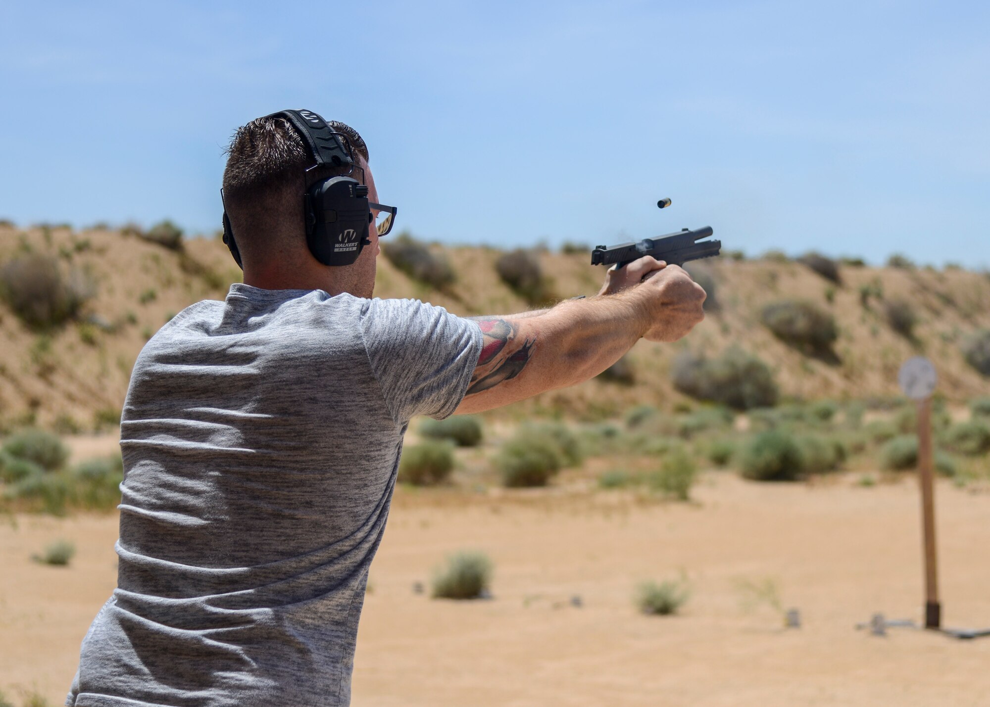 Senior Airman Todd Gross, 412th Security Forces Squadron, participates in a shooting competition during Police Week, at Edwards Air Force Base, California, May 14. Police Week is observed May 13-17. (U.S. Air Force photo by Giancarlo Casem)