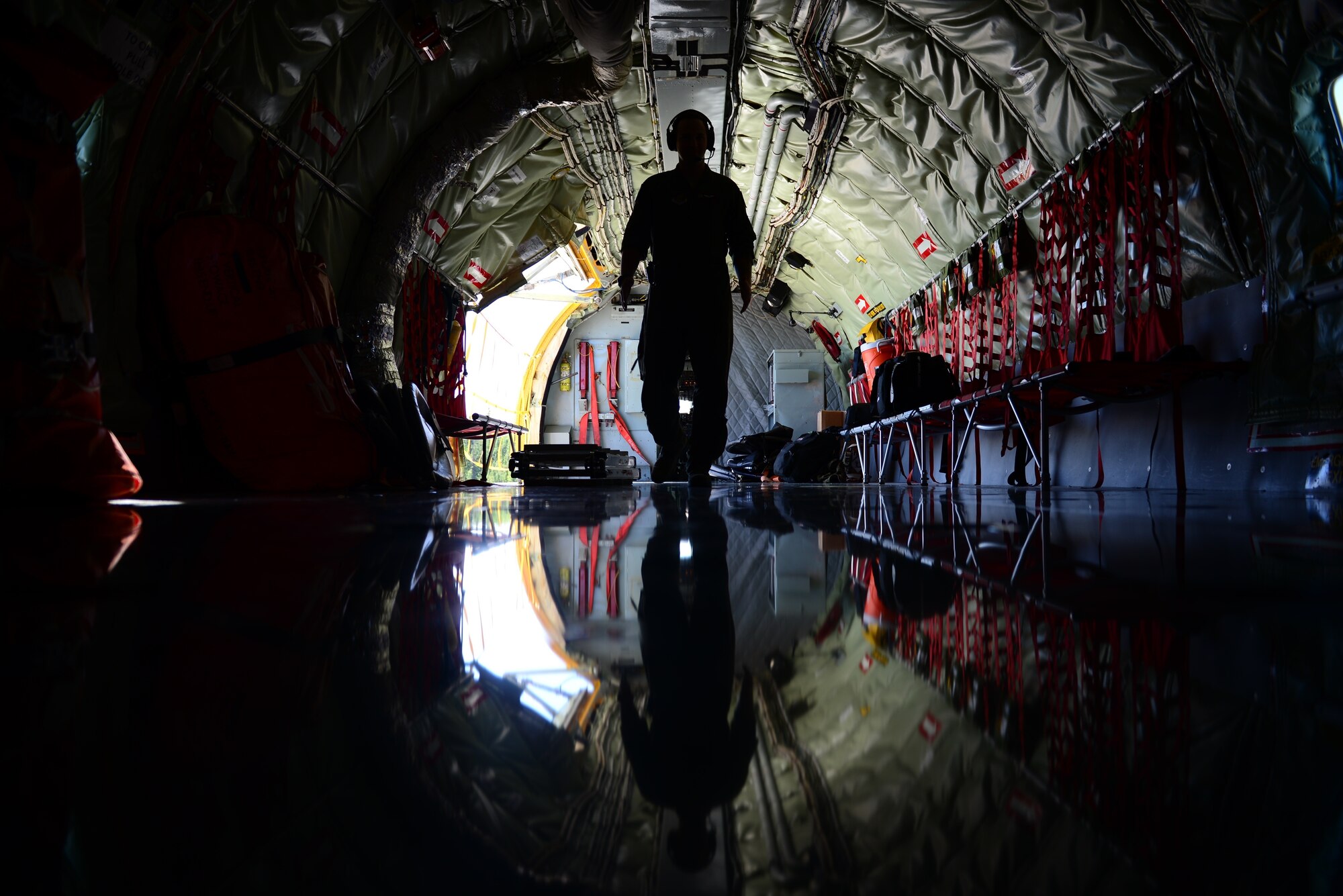 U.S. Air Force Senior Airman Taylor Manz, a boom operator assigned to the 909th Air Refueling Squadron, walks through a KC-135R Stratotanker during exercise Northern Edge, May 16, 2019, at Eielson Air Force Base, Alaska.