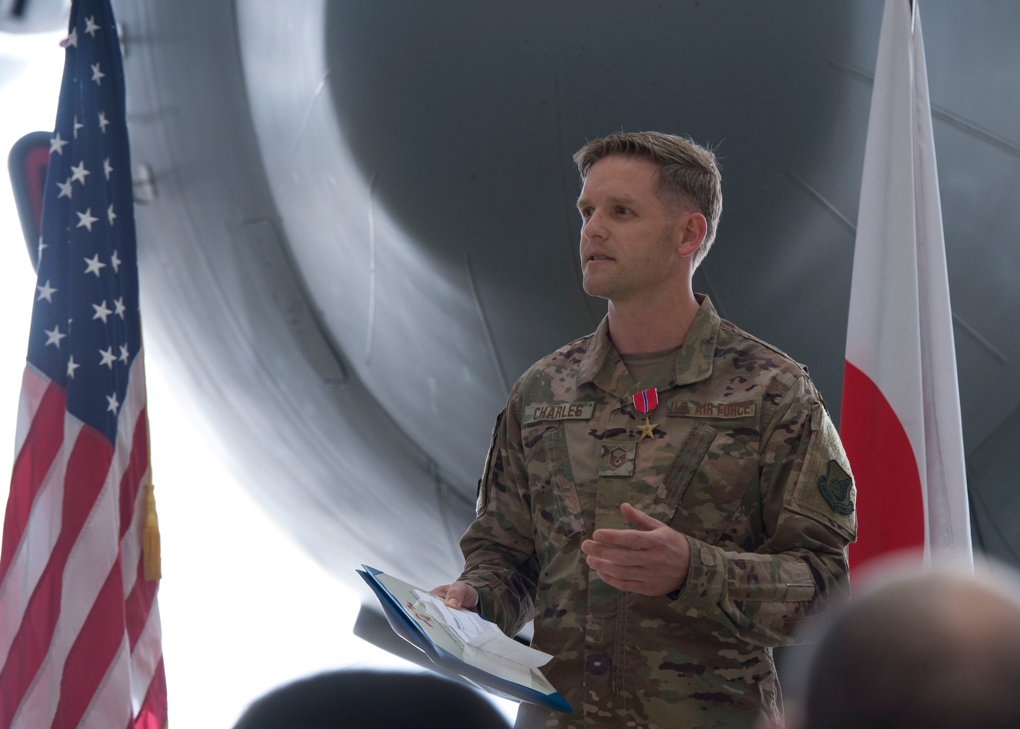Master Sgt. James Charles, 374th Aircraft Maintenance Squadron production superintendent, speaks about receiving the Bronze Star Medal, during a ceremony held at Yokota Air Base, Japan