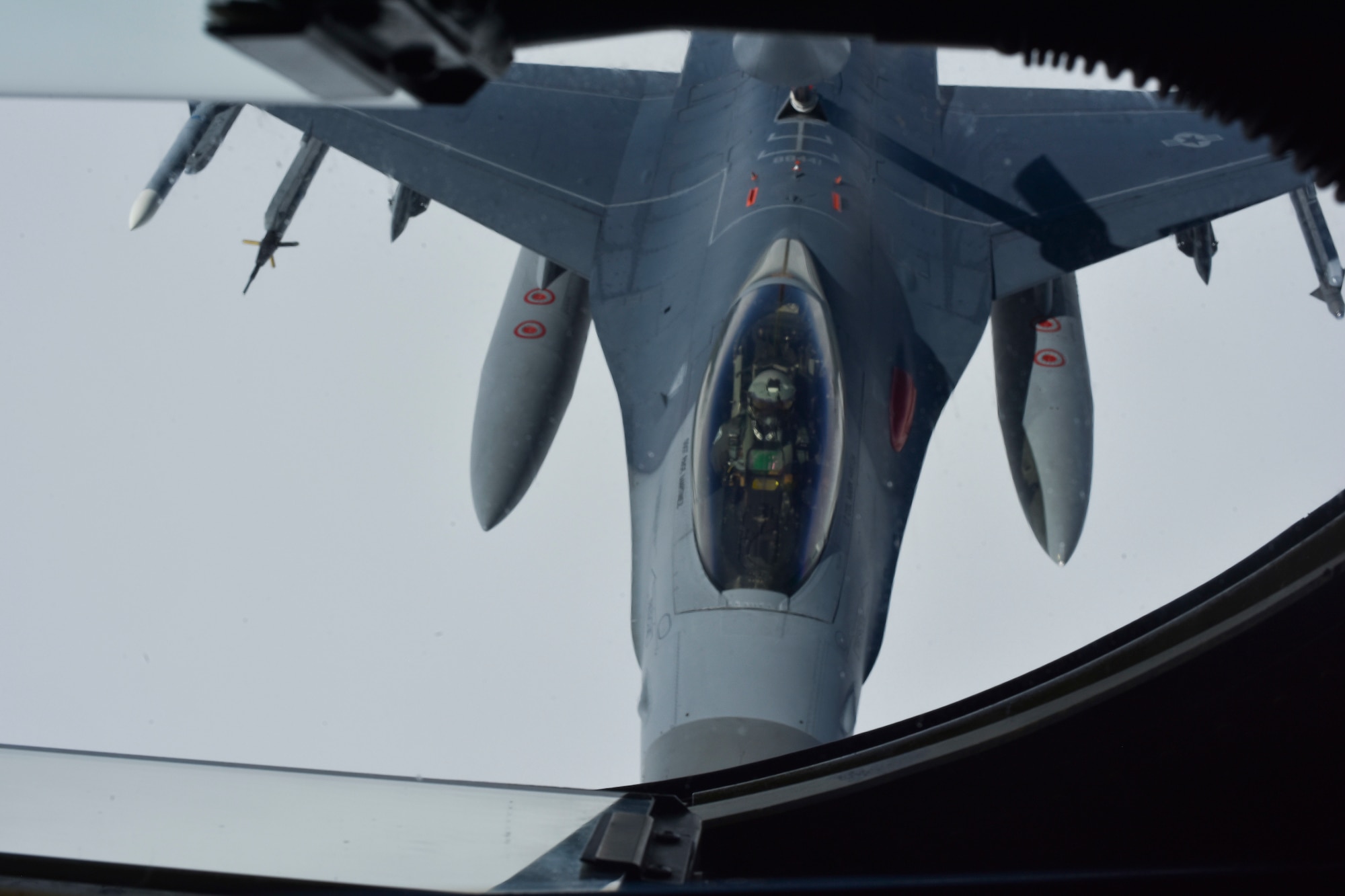 A U.S. Air Force F-16C Fighting Falcon assigned to the 96th Test Wing, Eglin Air Force Base, Florida, receives fuel from a 909th Air Refueling Squadron KC-135R Stratotanker during Northern Edge (NE19), May 16, 2019, over the Gulf of Alaska.