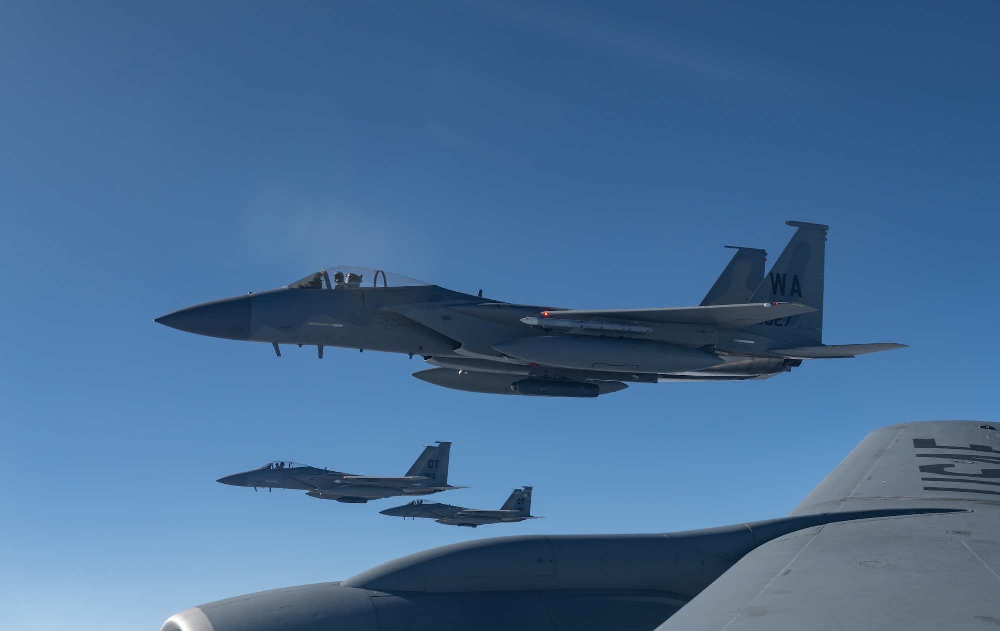 U.S. Air Force F-15C Eagles assigned to the 53rd Wing at Eglin Air Force Base, Fla., and the 57th Wing from Nellis Air Force Base, Nev., fly next to a KC-135R Stratotanker assigned to the 909th Air Refueling Squadron from Kadena Air Base, Japan, after refueling during exercise Northern Edge, May 16, 2019, over Alaska.