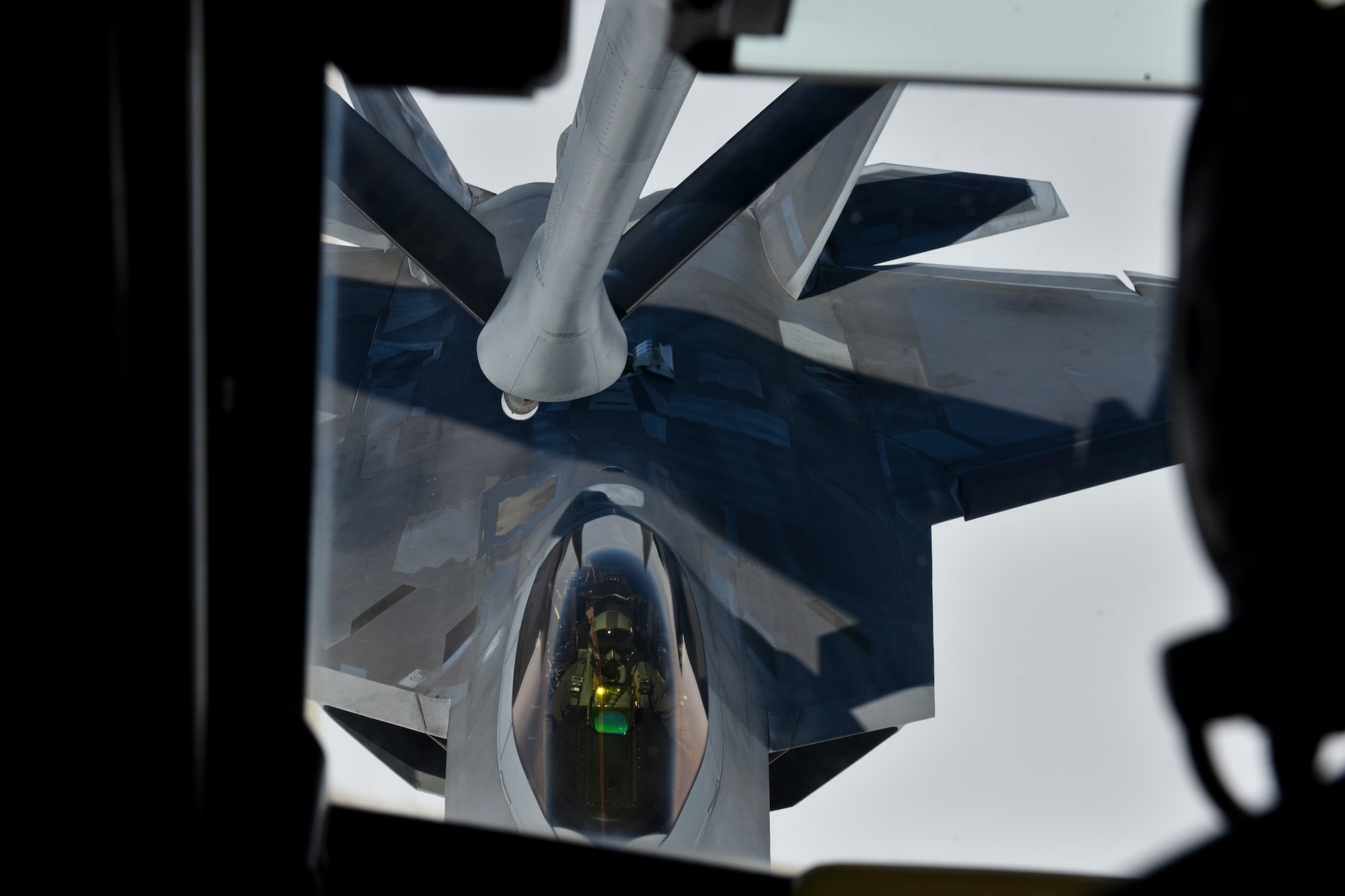 A U.S. Air Force F-22 Raptor assigned to the 525th Fighter Squadron, Joint Base Elmendorf-Richardson, Alaska, prepares to receive fuel from a 909th Air Refueling Squadron KC-135R Stratotanker during Northern Edge (NE19), May 16, 2019, over the Gulf of Alaska.