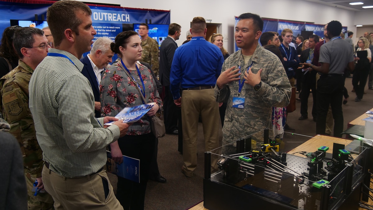 2nd Lt. J.D. Vela Cruz, an laser weapons & aerodynamics engineer from AFRL’s Directed Energy Directorate, explains how directed energy amplifies speed, range, precision and accuracy to attendees at the AFRL 2019 Tech Expo event. (U.S. Air Force photo/Keith Lewis)