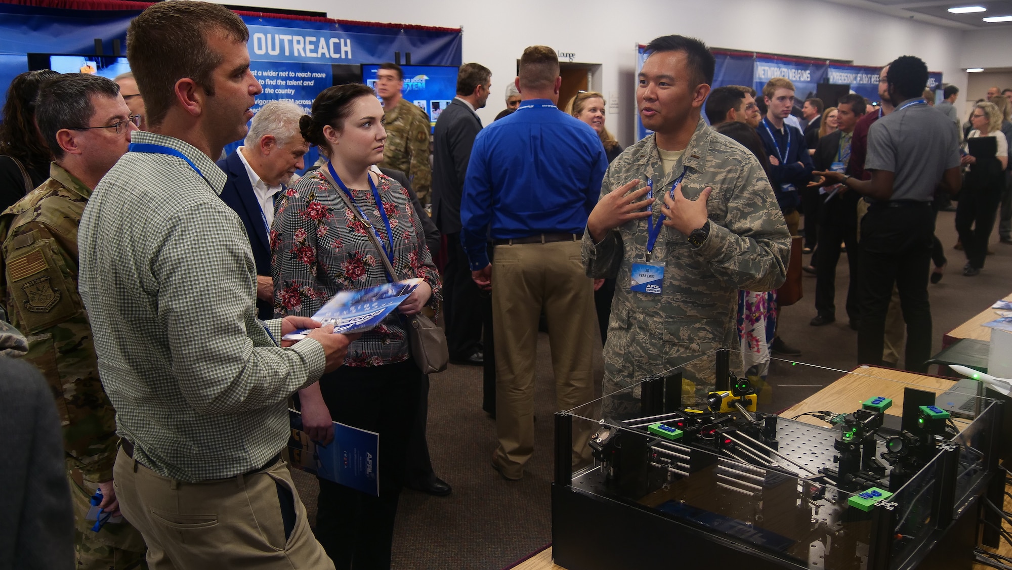 2nd Lt. J.D. Vela Cruz, an laser weapons & aerodynamics engineer from AFRL’s Directed Energy Directorate, explains how directed energy amplifies speed, range, precision and accuracy to attendees at the AFRL 2019 Tech Expo event. (U.S. Air Force photo/Keith Lewis)