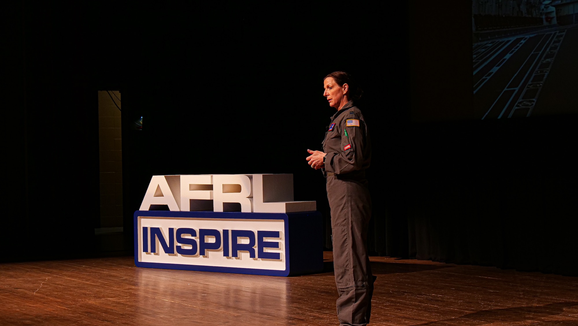Capt. Sarah Woody, deputy course director for the Critical Air Transport (CCAT) initial course at the United States Air Force School of Aerospace Medicine, presents her Inspire talk, entitled, “Thought for Food.” (U.S. Air Force photo/Keith Lewis)