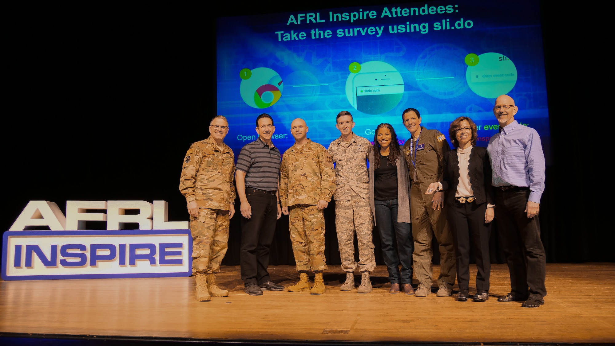 The AFRL 2019 Inspire/Tech Expo event featured seven guest speakers who showcased innovative ideas and the passionate people AFRL has to offer in short, entertaining and thought-provoking talks. Left to right: Maj. Gen. William Cooley, AFRL commander, Inspire speakers Peter Mozloom, 2nd Lt. Justin Davis, 1st Lt. Brennan Taylor, Amber Anderson, Capt. Sarah Woody, Dr. Ivett Leyva, and Dr. Dan Miracle. (U.S. Air Force photo/Keith Lewis)