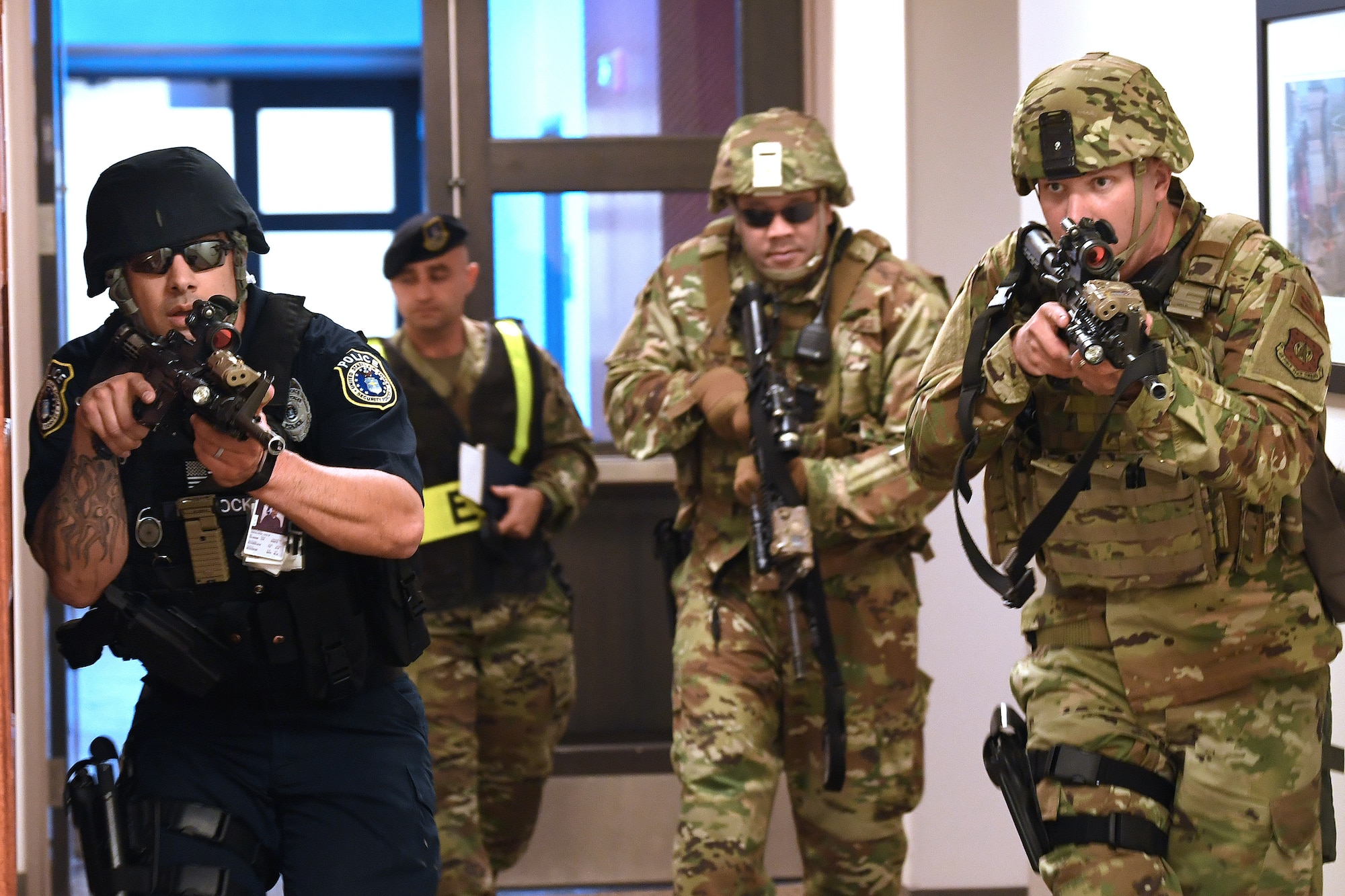 SCHRIEVER AIR FORCE BASE, Colo.--50th Security Forces Squadron members respond to a simulated threat scenario during the Front Range Expeditionary Exercise in Building 210 at Schriever Air Force Base, Colorado, April 25, 2019. Actions carried out by 50th SFS members in exercise and in real time are supported by the efforts of the 50th SFS anti-terrorism flight, who are responsible for maintaining the force protection measures for all of Schriever AFB as well as off-site facilities within the Front Range and geographically separated units around the world. (U.S. Air Force photo by Dennis Rogers)