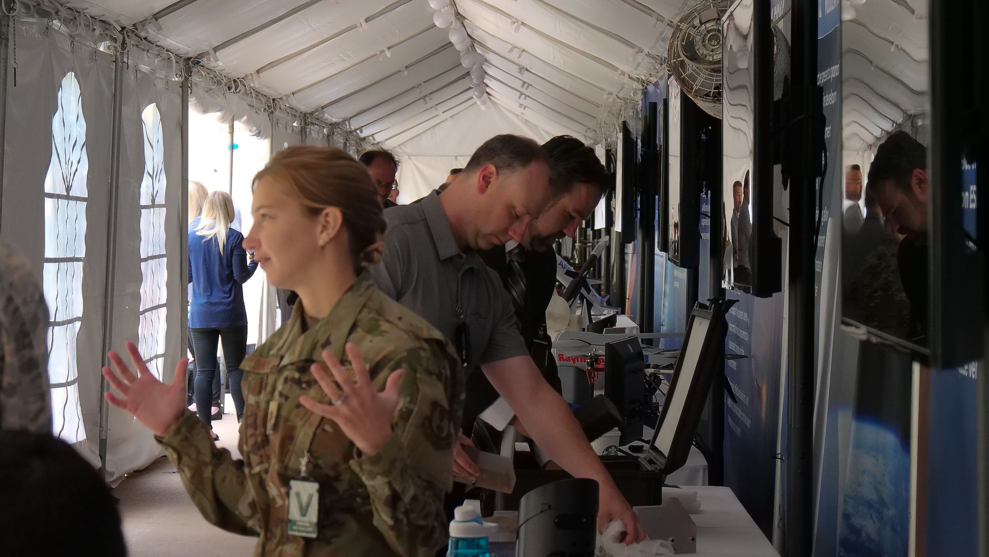 At the 2019 DOD Lab Day April 25, 2019, Maj. Elizabeth DeNeve, a program manager for the ESPA Augmented Geosynchronous Laboratory Experiment (EAGLE), asked kids to think about the ways they use space on a daily basis, for instance through GPS navigation and communication tools (satellite TV and radio). She translated this basic understanding into explaining how the Air Force is working to make space more affordable and accessible for future generations. (U.S. Air Force photo/Keith Lewis)