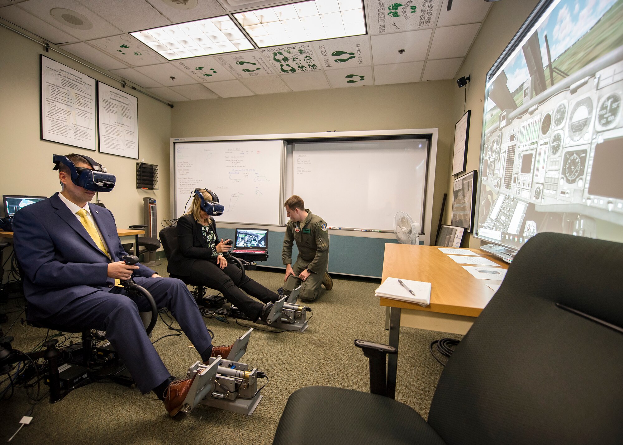 Dr. John Matyjas, left and Dr. Donna Joyce, science and technology advisors for Air Combat Command test the 41st Rescue Squadron’s (RQS) virtual reality flight simulator, May 16, 2019, at Moody Air Force Base, Ga. Matyjas and Joyce visited the 41st RQS to tour and assess their VR simulator along with taking a fam flight on an HH-60G Pave Hawk. The visit is a part of an Air Force assessment of the possible implementation of VR in training. The 41st RQS VR flight simulator is an initiative that was selected at the Moody Air Force Base 2018 Spark Tank competition. (U.S. Air Force photo by Airman 1st Class Eugene Oliver)