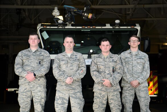 Senior Airman Ryan Younger, 14th Security Forces Squadron patrolman, Tech. Sgt. Eric Lannon, 14th Contracting Squadron contracting officer, Staff Sgt. Joshua Kenney, 14th Civil Engineer Squadron firefighter, and Senior Airman Dylan Fivecoate, 14th Operations Support Squadron air traffic controller, stand outside of the 14th CES fire station May 20, 2019, on Columbus Air Force Base, Mississippi.
