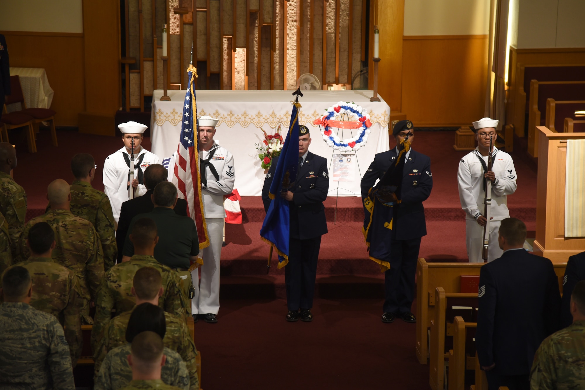 Members of the 72nd Security Forces Squadron and the Navy's Master-at-Arms served in the Honor Guard during the National Police Week Memorial Service at the Tinker Chapel May 15. The service honored the 159 military and civilian law enforcement officers and K9s that have died in the line of duty this past year. (U.S. Air Force photo/Kelly White)