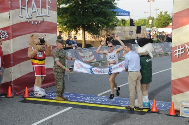 A husband and wife duo earned the top Semper 5ive finishes. Mark Hopely, 30, set a new Semper 5ive course record by two seconds with his top finish of 27:18. Emily Hopely, 32, was the top female finisher with a time of 34:30. The couple shared the awards stage celebrating a shared win in their hometown of Fredericksburg, VA.