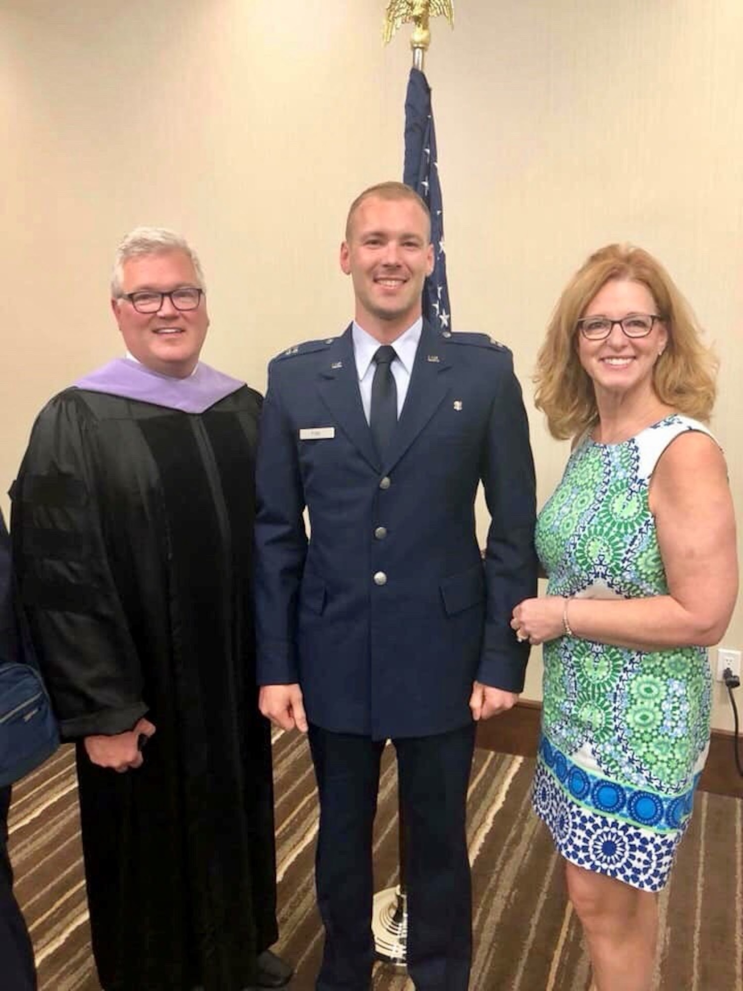 Dr. Richard Fink, Dr. Keane, and Rhonda Fink at his graduation and promotion ceremony. (Courtesy photo)