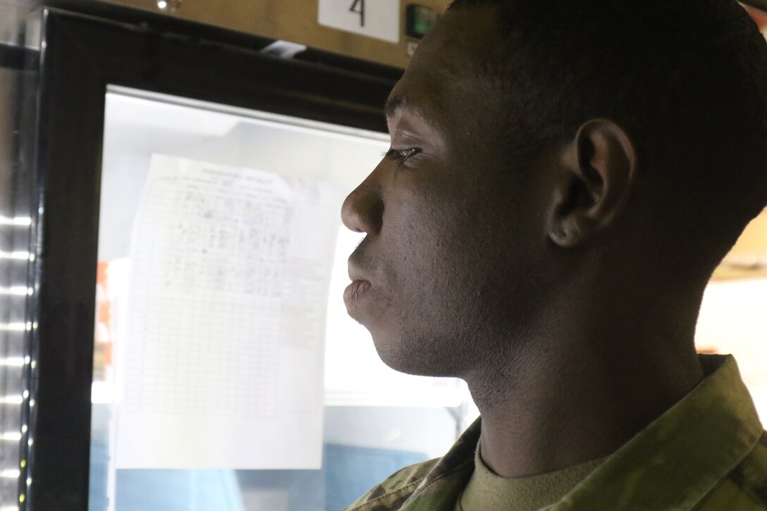 Capt. Karl Jones, 184th Sustainment Command, checks medical supplies at a warehouse at Camp Arifjan, Kuwait, May 15, 2019.