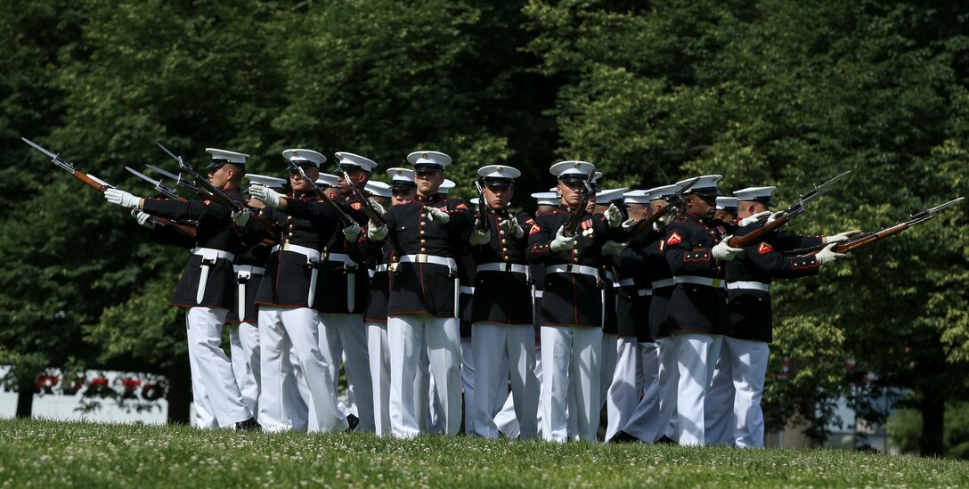 Marines with the U.S. Marine Corps Silent Drill Platoon, Marine Barracks Washington D.C., execute their “bursting bomb” sequence for an Honor Flight at the Marine Corps War Memorial, Arlington, Virginia, May 22, 2019. An Honor Flight is conducted by non-profit organizations dedicated to transporting as many United States military veterans as possible to see the memorials in D.C. of the respective war they fought in at no cost to the veterans. (U.S. Marine Corps photo by Pfc. Allen Sanders)