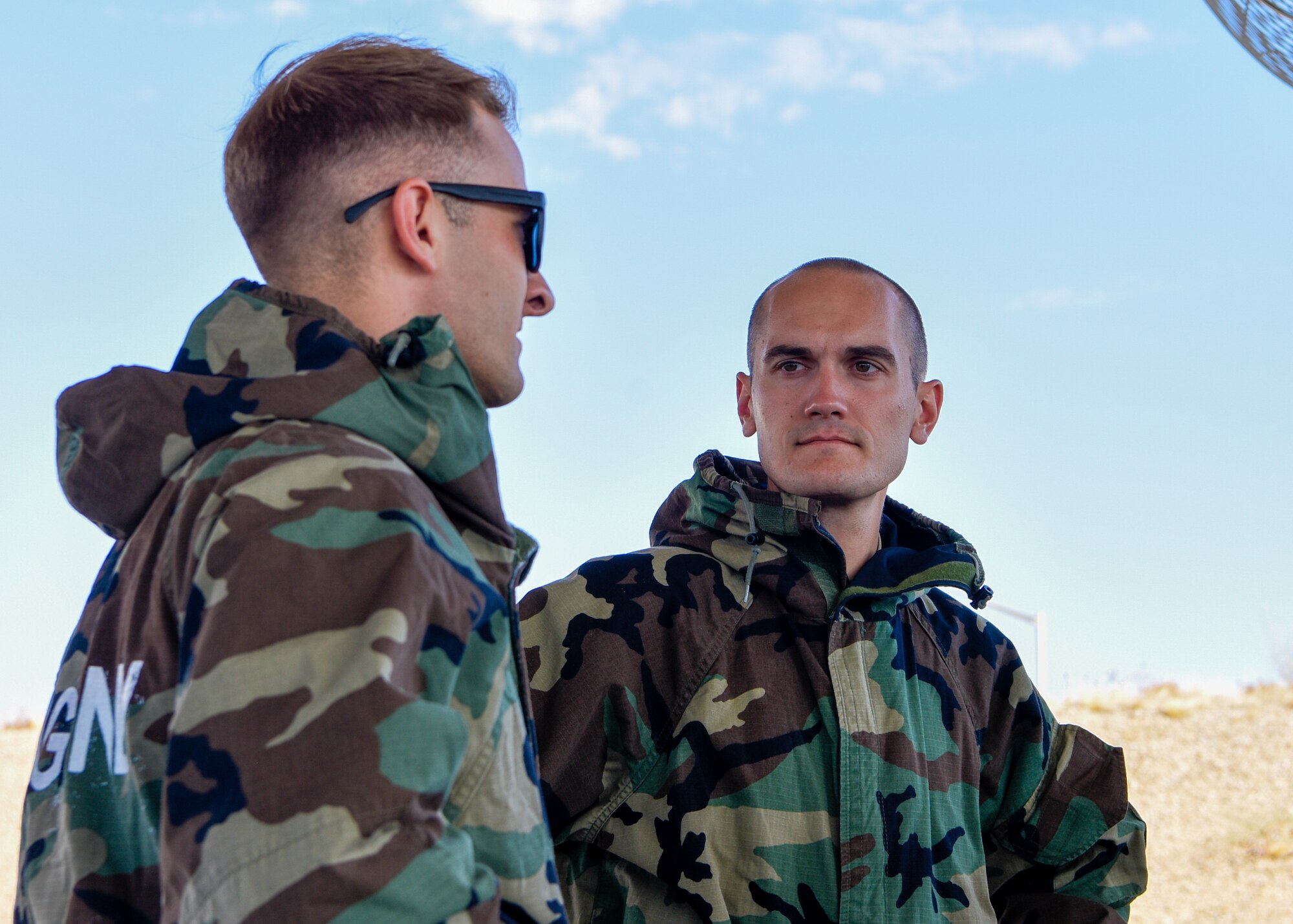 Master Sgt. Seth Yothers (right), 56th Equipment Maintenance Squadron Munitions Stockpile Management noncommissioned officer in charge, listens to Staff Sgt. Cody Huntington (left), 56th EMS Air Force Combat Munitions competition team member, during a team meeting May 8, 2019 at Luke Air Force Base, Ariz.