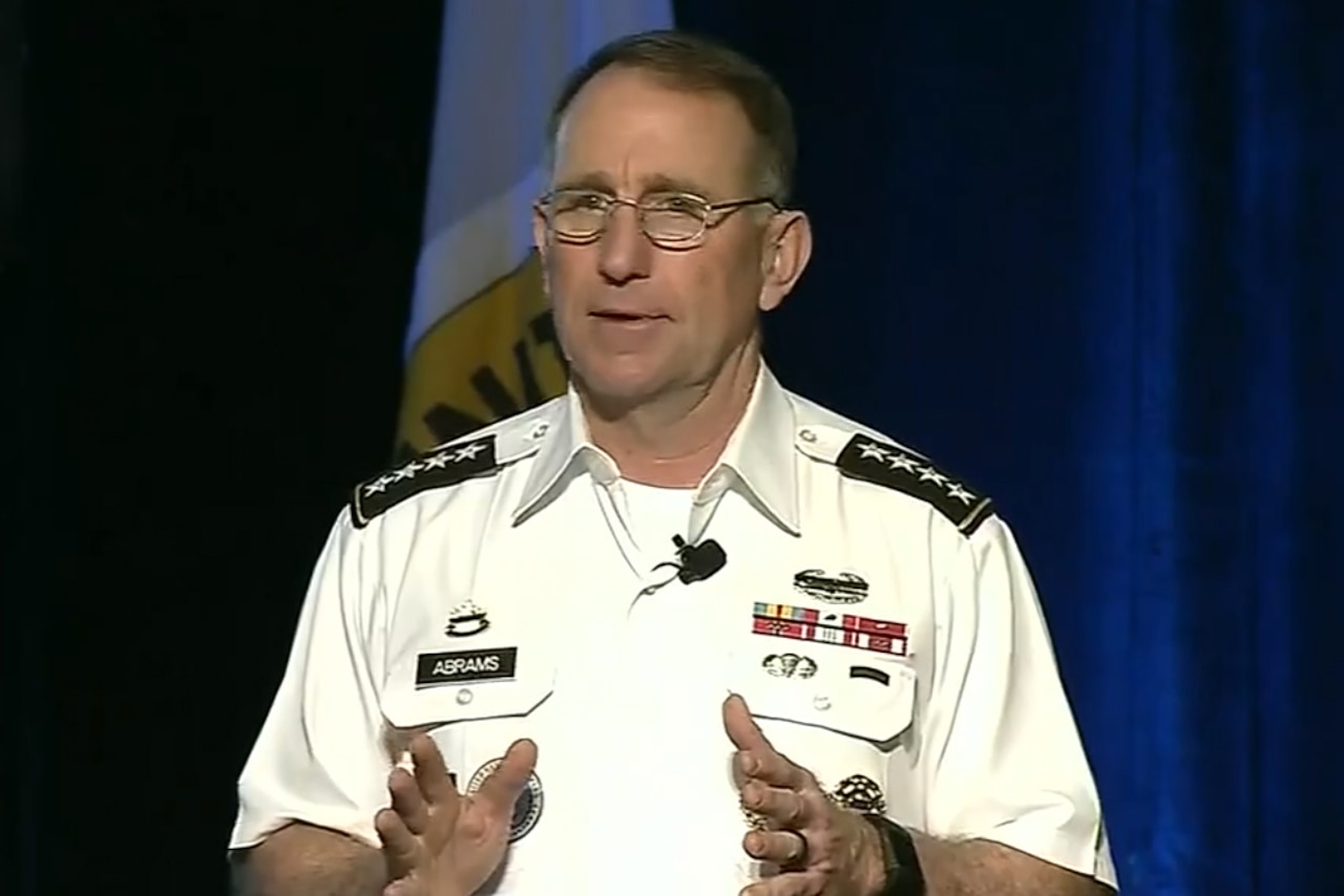 A military officer speaks to an audience.