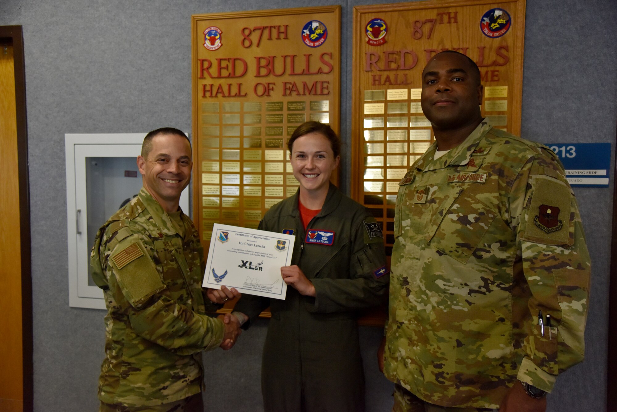 1st Lt. Claire Latscha, a 87th Flying Training Squadron instructor pilot, was chosen by wing leadership to be the “XLer” of the week, for the week of May 13, 2019, at Laughlin Air Force Base, Texas. The “XLer” award, presented by Col. Lee Gentile, 47th Flying Training Wing commander, is given to those who consistently make outstanding contributions to their unit and the Laughlin mission. (U.S. Air Force photo by Senior Airman John A. Crawford)