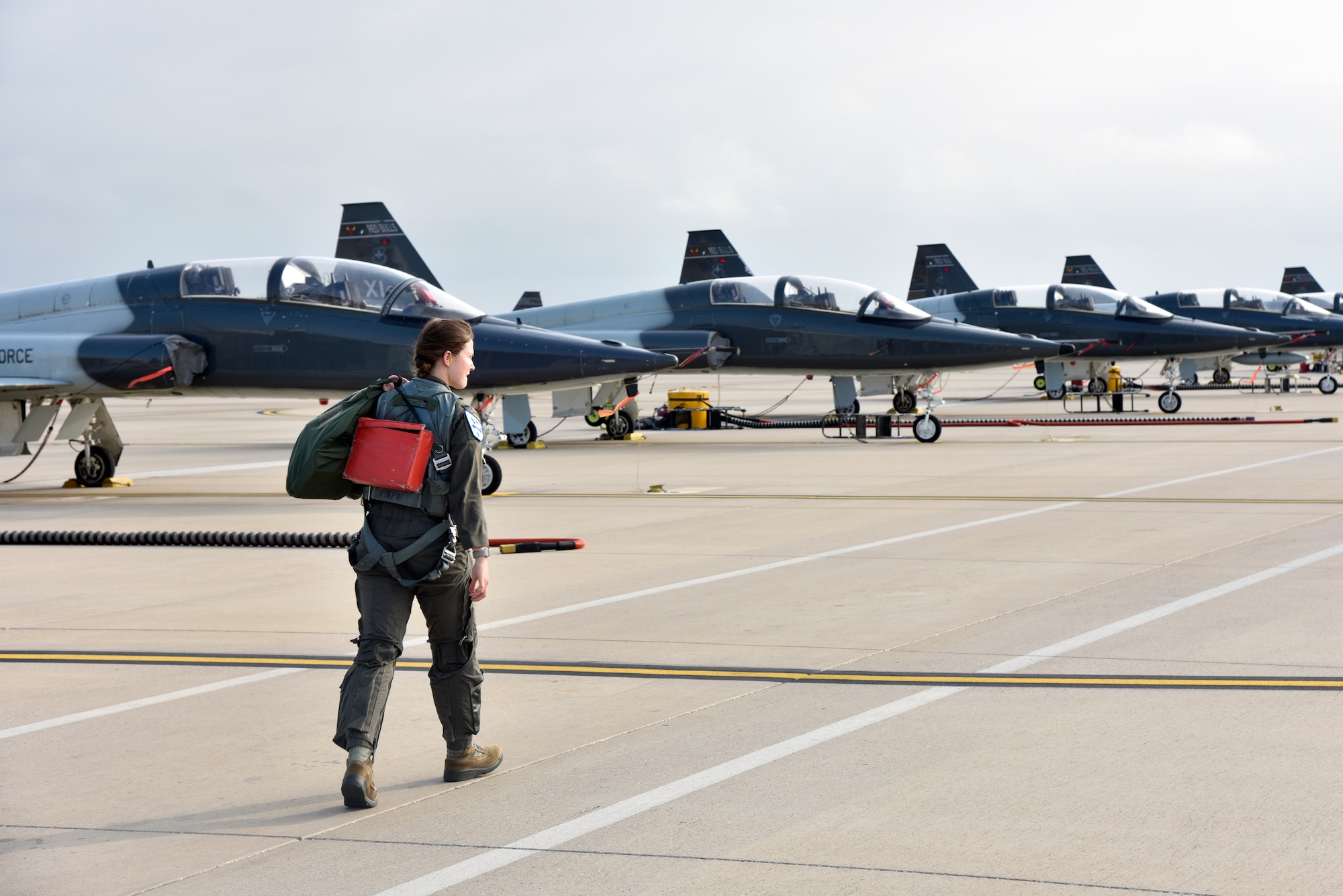1st Lt. Claire Latscha, a 87th Flying Training Squadron instructor pilot, moves to an aircraft for a training mission at Laughlin Air Force Base, Texas, May 17, 2019. Latscha helped the 19th Air Force pen new techniques for aviators flying in the T-38C Talon airframe, helping to strengthen the Specialized Undergraduate Pilot Training program for the fighter aircraft track and is now used across all of Air Education and Training Command. (U.S. Air Force photo by Senior Airman John A. Crawford)