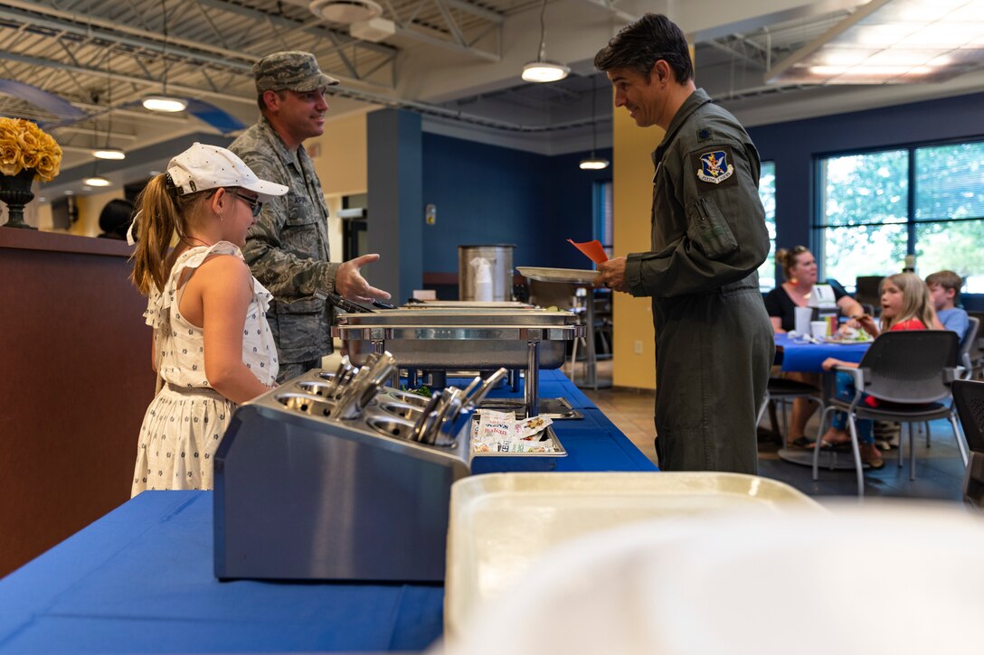 Participants socialize during a deployed spouses dinner, May 21, 2019, at Moody Air Force Base, Ga. The mission’s success depends on resilient Airmen and families, who are prepared to make sacrifices with the support of their fellow Airmen, local communities and leadership. (U.S. Air Force photo by Airman Elijah Dority)