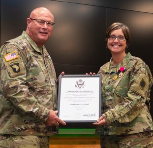 Maj. Gen. Michael Zerbonia, Assistant Adjutant General – Army and Commander, Illinois Army National Guard, presents Sgt. Maj. Sharon Hultquist, of Delavan, Illinois, with the Certificate of Retirement from the U.S. Army during Hultquist’s retirement ceremony May 17 at the Illinois Military Academy, Camp Lincoln, Springfield, Illinois. Hultquist retires from the military May 31 after more than 30 years of service. (U.S. Army photo by Barbara Wilson, Illinois National Guard Public Affairs Office)