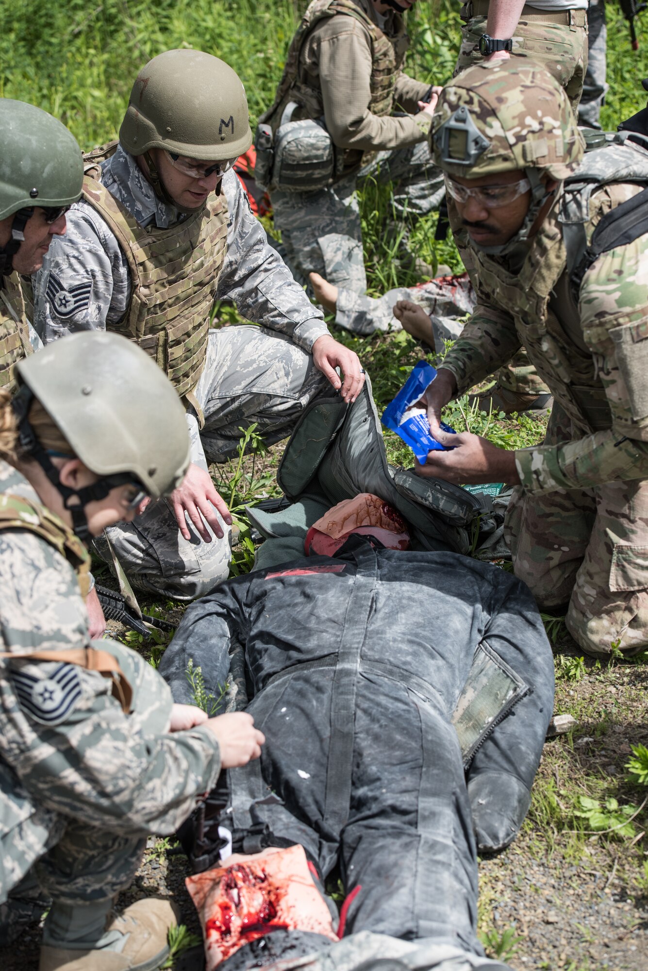 U.S. Airmen from the 193rd Special Operations Medical Group Detachment 1, Pennsylvania Air National Guard, perform medical treatment on a casualty during Tactical Combat Casualty Care training.