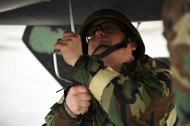 Sheet metal technician Staff Sgt. Jesse thompson, 309th Aircraft Maintenance Group Expeditionary Depot Maintnenance, installs an aircraft engine panel during an exercise at Hill Air Force Base, Utah, May 21, 2019.