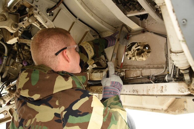 Crew chief Staff Sgt. Lance Mosley, 309th Aircraft Maintenance Group Expeditionary Depot Maintnenance, cuts a pneudraulic line during an exercise at Hill Air Force Base, Utah, May 21, 2019.