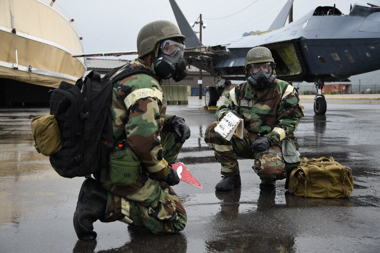 Airmen assigned to the 309th Aircraft Maintenance Group Expeditionary Depot Maintenance identify simulated unexploded ordinance during an exercise at Hill Air Force Base, Utah, May 21, 2019.
