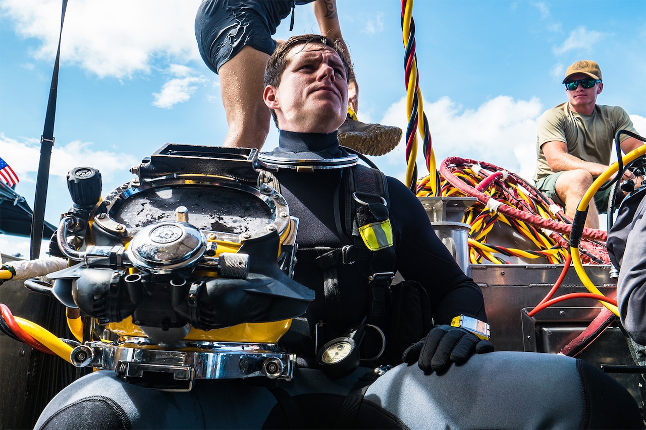 Diver rests on ship.