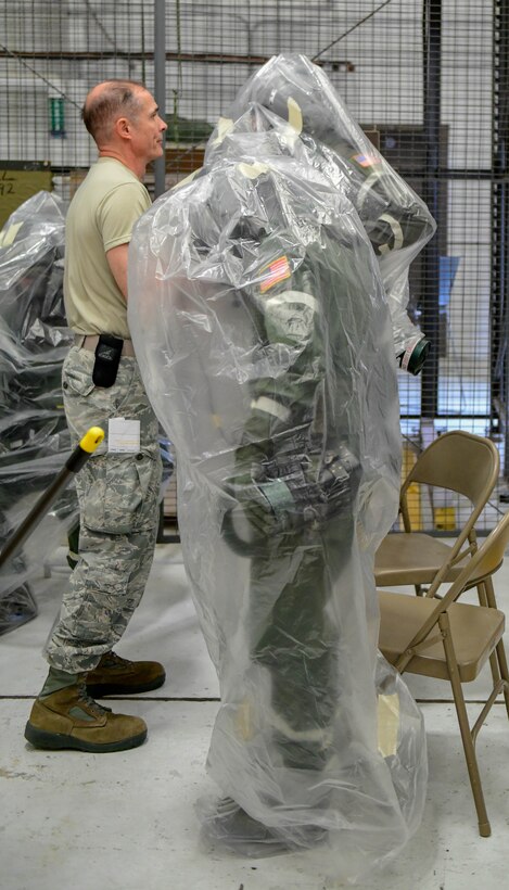 Master Sgt. Phil Walsh, aircrew flight equipment supervisor assigned to the 910th Operations Support Squadron, debriefs aircrew members assigned to the 757th Airlift Squadron on May 4, 2019.