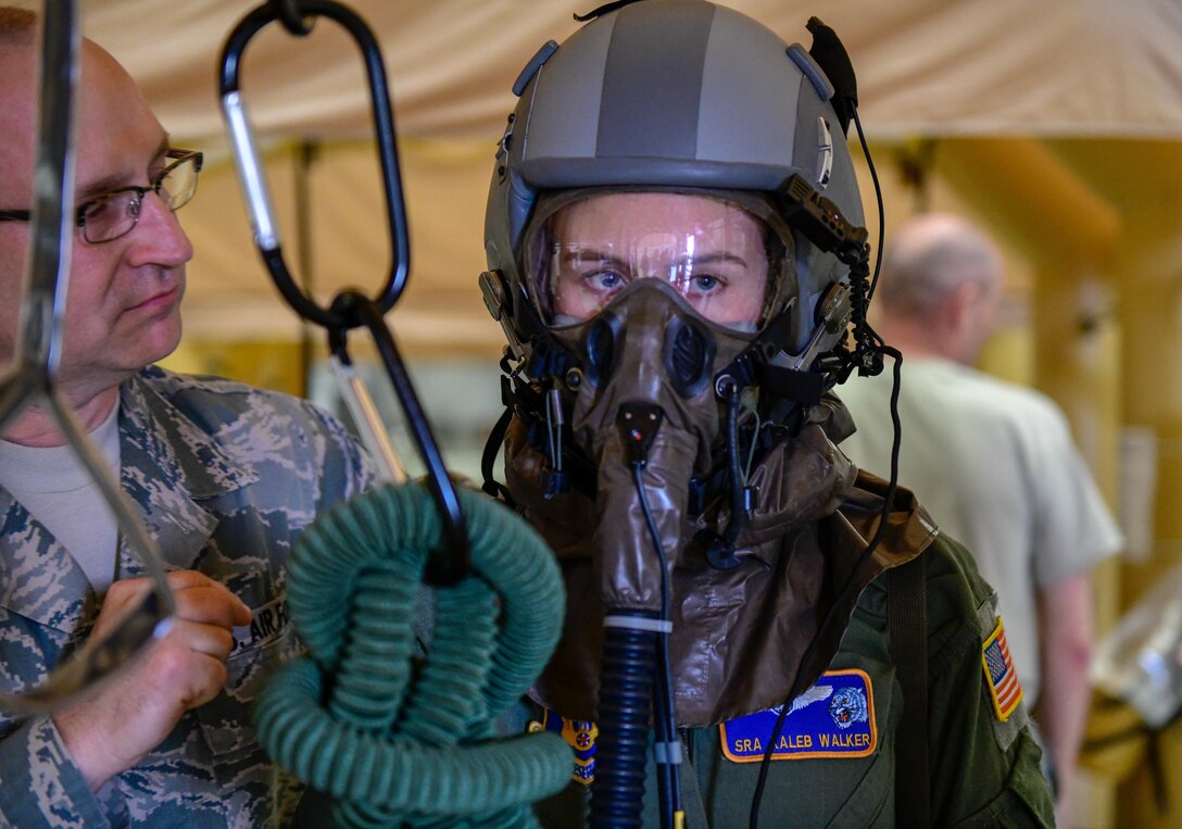 Tech. Sgt. Rob Runnion, an aircrew flight equipment technician assigned to the 910th Operations Support Squadron, gives instructions for the next step in the processing line to Senior Airman Kaleb Walker, a loadmaster assigned to the 757th Airlift Squadron on May 4, 2019.