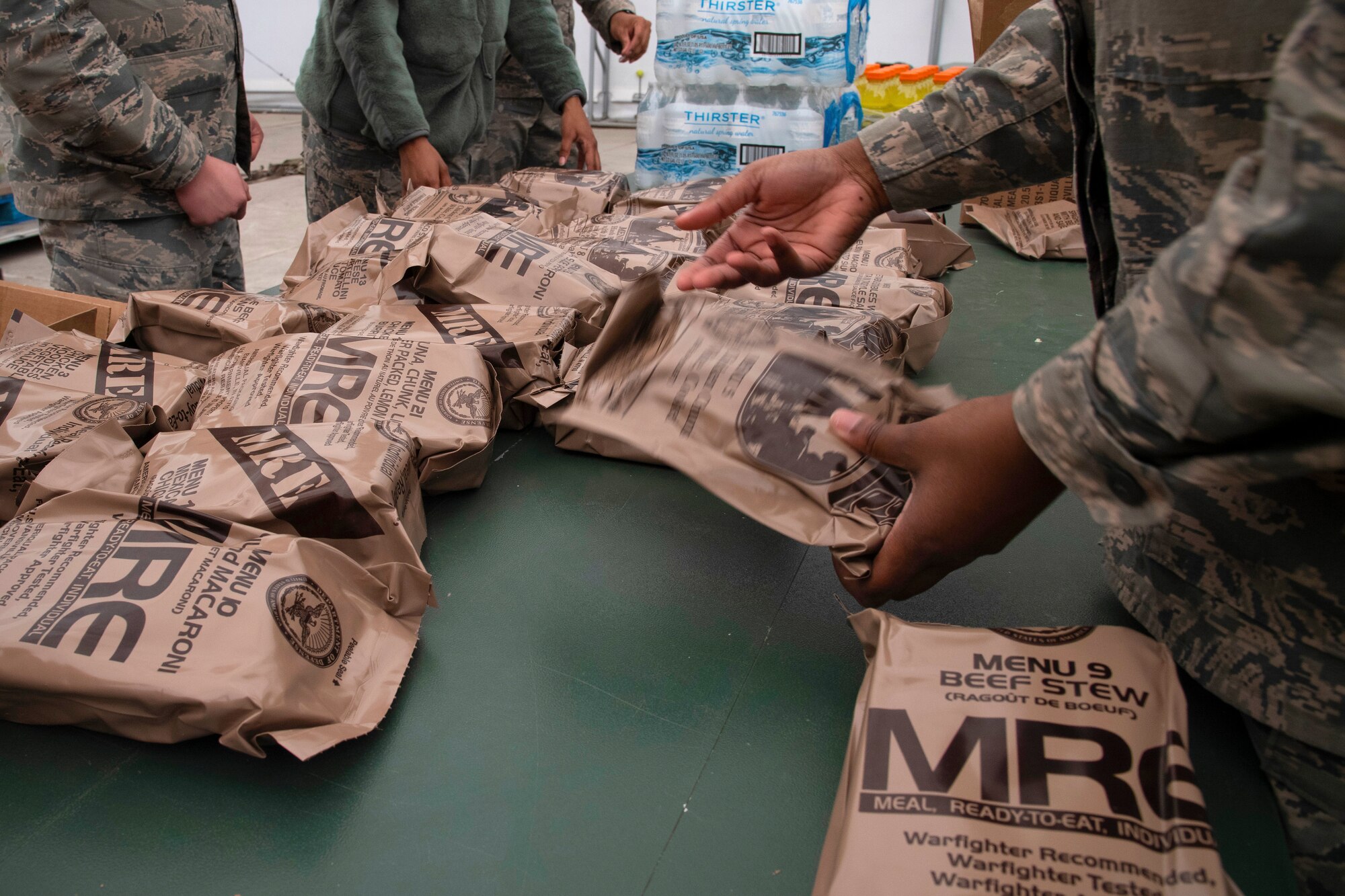 Grand Forks Air Force Base 319th Force Support Squadron airmen sort through ready-to-eat meals May 20, 2019, prior to exercise Summer Viking 19-01 on the Air National Guard Base in Fargo, North Dakota. The readiness exercise focused on preparing and responding to chemical and biological attacks, self-aid and buddy care, and defending a contested base. (U.S. Air Force photo by Senior Airman Elora J. Martinez)