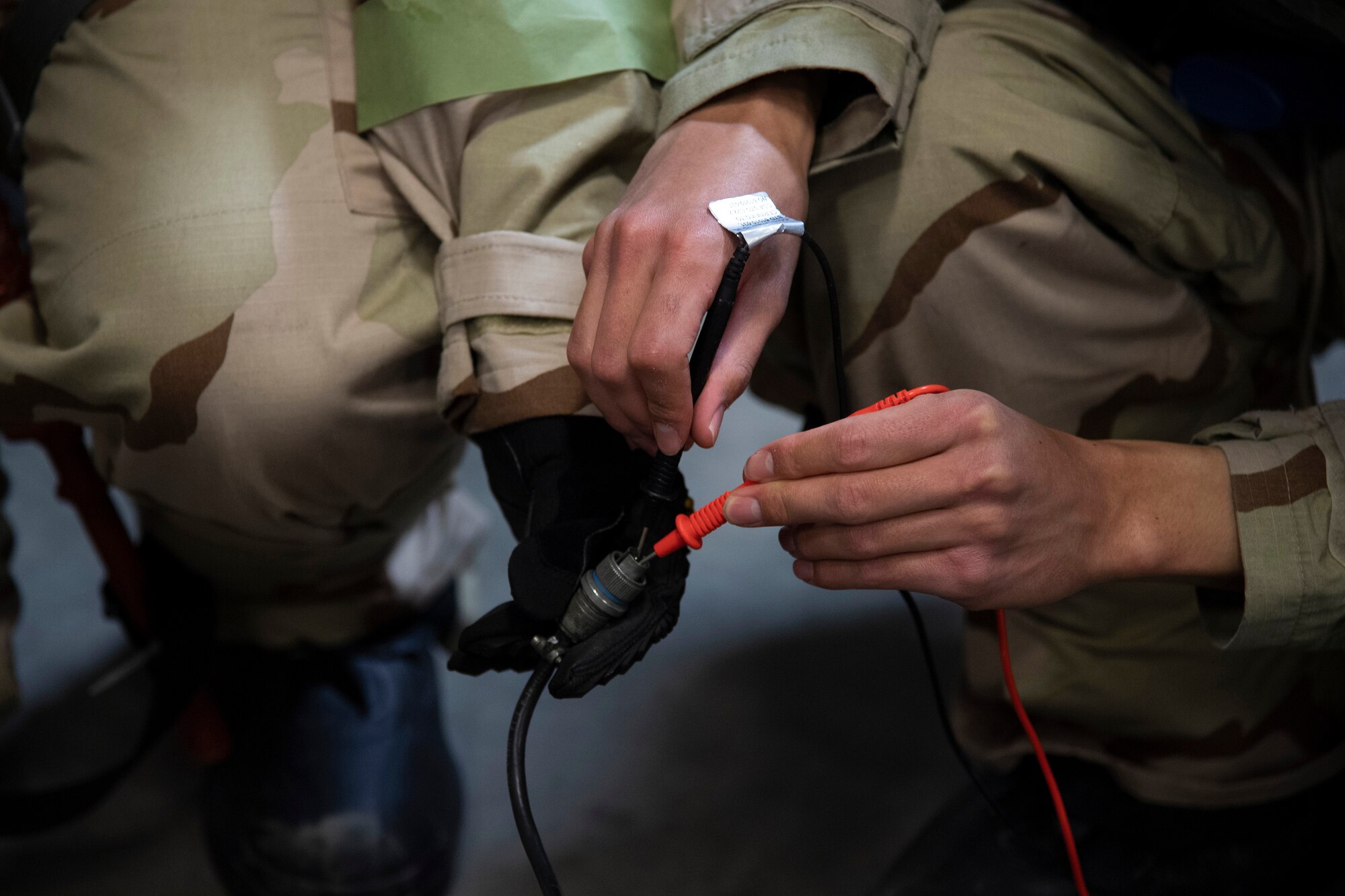 Airmen with the 319th Civil Engineer Squadron work together to level out a tilt switch on a precision approach path indicator May 22, 2019, during exercise Summer Viking 19-01 at the Air National Guard Base in Fargo, North Dakota. The PAPI, an airfield lighting system, is crucial for all flight lines in order to assist incoming pilots to see which angle to land at. (U.S. Air Force photo by Senior Airman Elora J. Martinez)