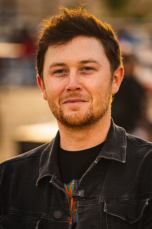Scotty McCreery, country music artist, prepares to go on stage at the 16th annual We Salute You event on Marine Corps Air Ground Combat Center, Twentynine Palms, Calif., May 18, 2019. The event was hosted by Marine Corps Community Services to show appreciation for service members and their families at the Combat Center. (U.S. Marine Corps photo by Lance Cpl. Colton Brownlee)